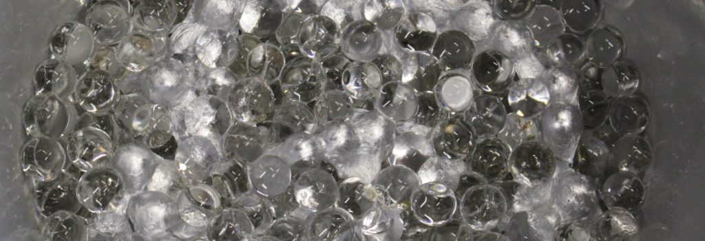 Greys, whites and reflections from florist's aqua beads - florists soak them and use them to support plants in water. Ready for smelted aluminium to be poured over them to create original 3D unusual artwork.